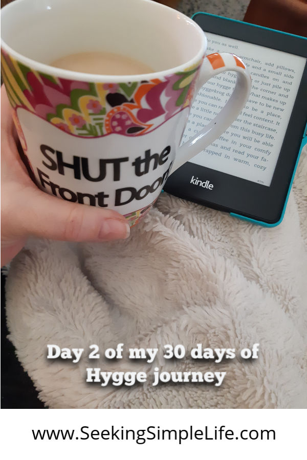 A cozy blanket, hot drink, and my Kindle in my favorite spot in the house. It's my hyggekrog along my 30 days of Hygge journey.