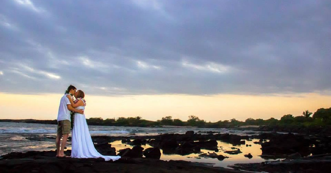 The location was Old Kona Airport Beach and we started the vow renewal at the same time we were married 21 years prior, just a different time zone. This is how we ended the ceremony as our children watched us show love in front of a sunset.